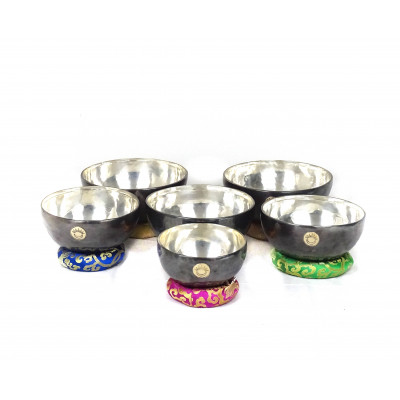 Sun Moon Singing bowls with silver patina inside and dark patina outside with sunmoon logo