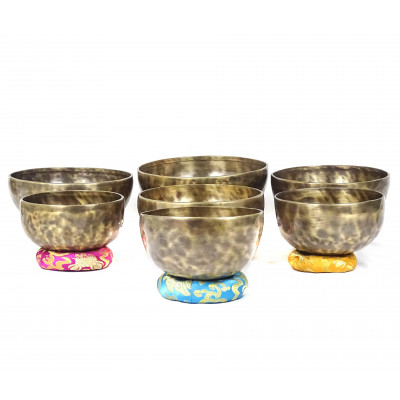 Patinated set of seven chakras singing bowls from Kathmadu nepal in the 3rd octave with accurate frequences