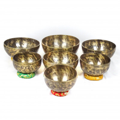 Patinated set of seven chakras singing bowls from Kathmadu nepal in the 3rd octave with accurate frequences