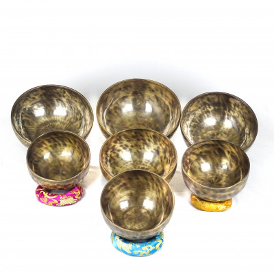 Patinated set of seven chakras singing bowls from Kathmadu nepal in the 3rd octave with accurate frequences
