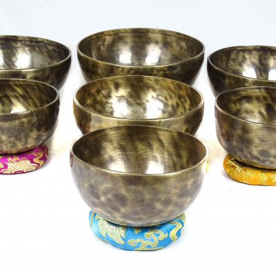 Patinated set of seven chakras singing bowls from Kathmadu nepal in the 3rd octave with accurate frequences