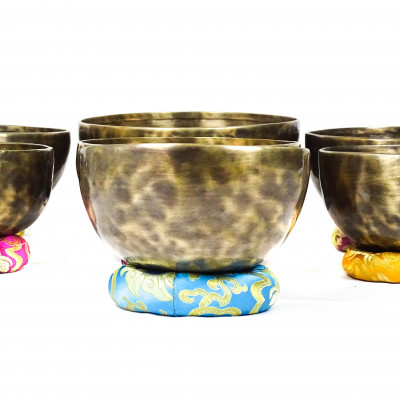 Patinated set of seven chakras singing bowls from Kathmadu nepal in the 3rd octave with accurate frequences