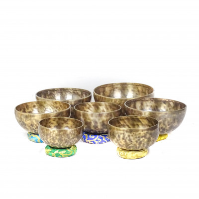 Patinated set of seven chakras singing bowls from Kathmadu nepal in the 3rd octave with accurate frequences