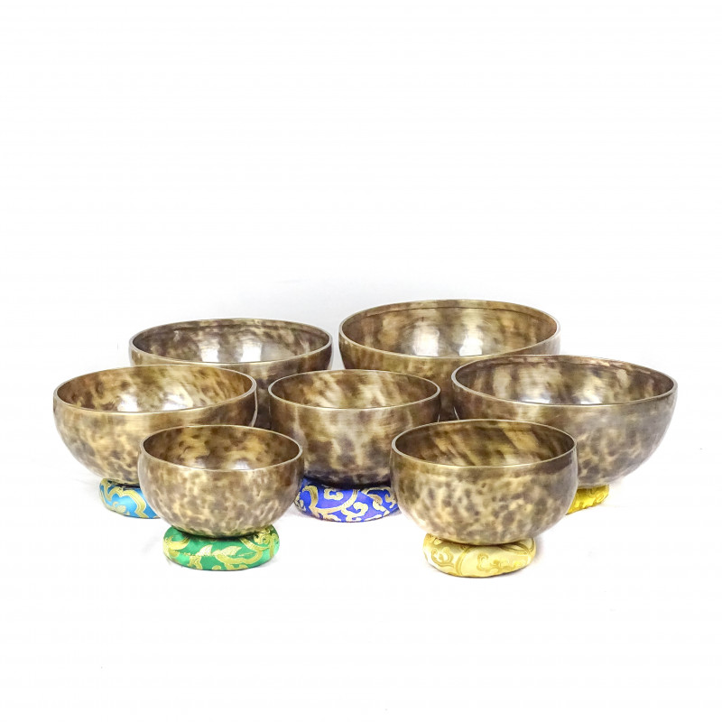 Patinated set of seven chakras singing bowls from Kathmadu nepal in the 3rd octave with accurate frequences
