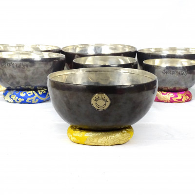 Sun Moon Singing bowls with silver patina inside and dark patina outside with sunmoon logo