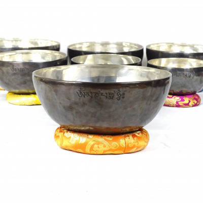 Sun Moon Singing bowls with silver patina inside and dark patina outside with sunmoon logo