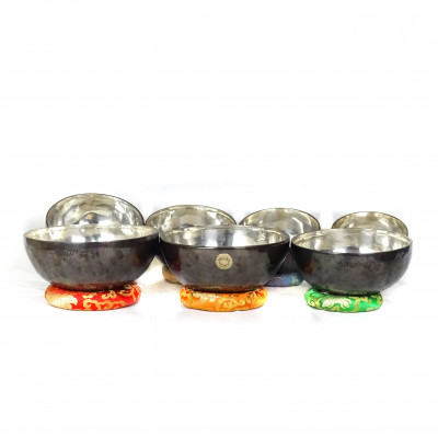 Sun Moon Singing bowls with silver patina inside and dark patina outside with sunmoon logo