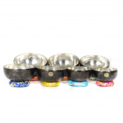 Sun Moon Singing bowls with silver patina inside and dark patina outside with sunmoon logo