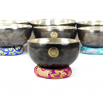 Sun Moon Singing bowls with silver patina inside and dark patina outside with sunmoon logo