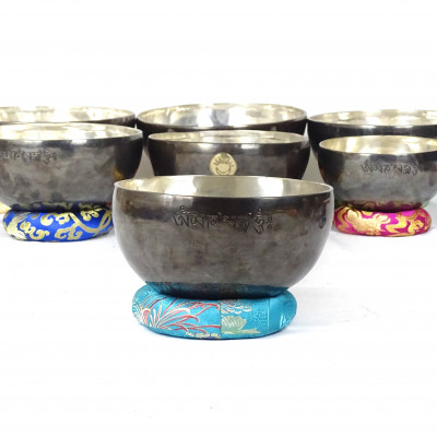 Sun Moon Singing bowls with silver patina inside and dark patina outside with sunmoon logo