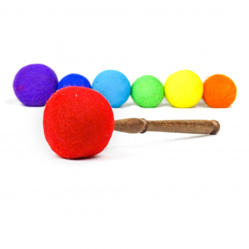 Red mallet drumstick accessories with handle in wood and soft head in red felt revelating long and deep sound vibrations