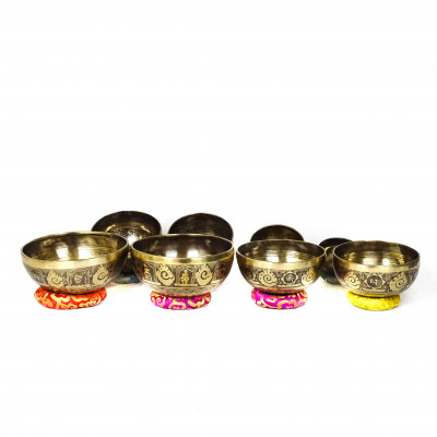 Hand hammered carved singing bowls carved with bouddhist symbols